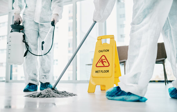 Decontamination Makes A Big Difference. Shot Of Healthcare Workers Wearing Hazmat Suits And Sanitising A Room During An Outbreak.