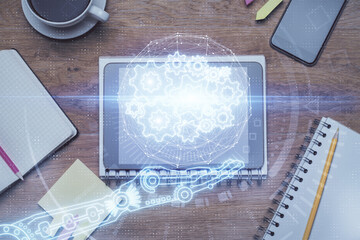 Double exposure of technology theme drawing over work table desktop. Top view. Global data analysis concept.