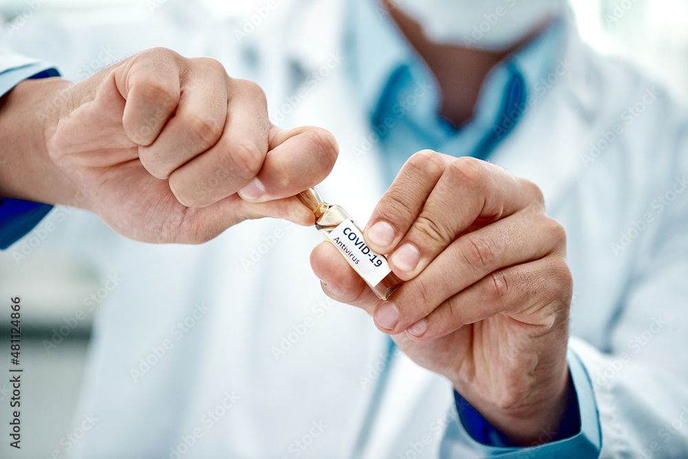 Poster millions of lives depend on it. cropped shot of a scientist opening an ampoule with 2019-ncov on it.