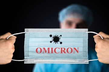 Medical face mask with - Omicron Covid-19 new variant - Omicron. Omicron variant of coronavirus