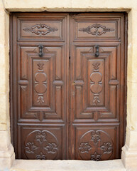 Old wooden door of a traditional house in a town in the province of Jaén in Andalusia, Spain 