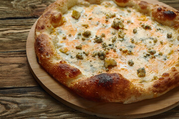 Italian Pizza Quattro formaggi. Italian pizza on dark stone background