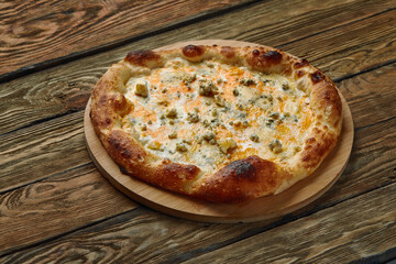 Italian Pizza Quattro formaggi. Italian pizza on dark stone background