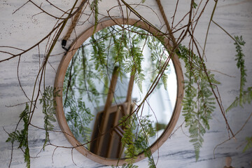 Fresh eucalyptus branches and bathroom items on countertop