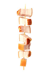 Pork and bacon skewers on a white background.