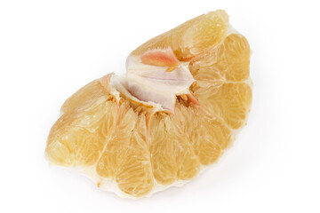 Peeled piece of ripe pomelo on a white background