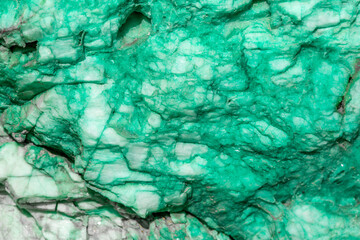 Background from dracocene crystals of stones. Fluorite stone in the rocks of the adit. Mineral stones in their natural environment. Semiprecious stones texture.