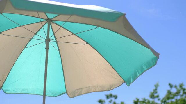 Umbrella on the beach in 4k slow motion 60fps