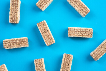Chocolate wafers on blue background