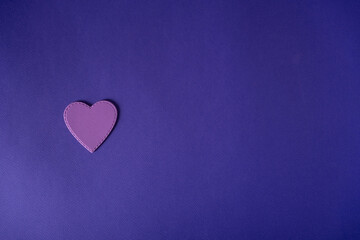 Purple heart on a blue background.