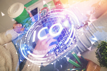 Fototapeta premium Double exposure of woman hands typing on computer and crypto market theme hologram drawing. Blockchain concept.