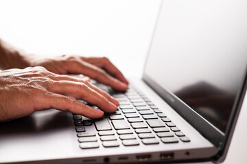 Man hand on laptop. Selective focused