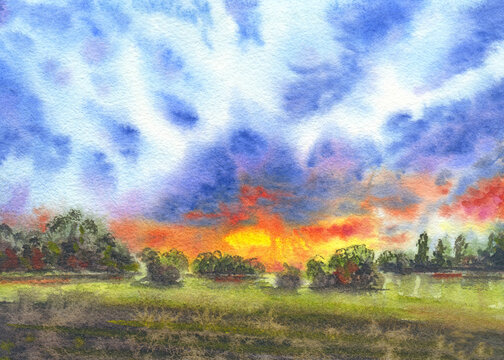 Sunrise over the forest and field. Fine Art Watercolor landscape painting. Bright colorful sky, clouds and sun. Illustration for prints, cards, stickers, covers