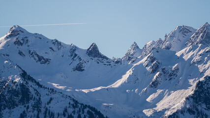 view of the snow capped alps, the hohe tauern in the national park in austria, at a clear sunny winter day