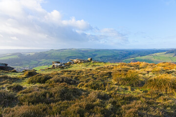 From the heather and rock covered top of Curbar Edge to the distant hills of the Derbyshire countryside.