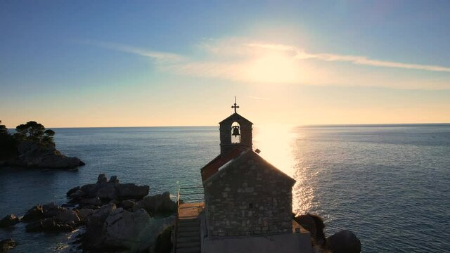 Church on a rock in sunset sunbeams