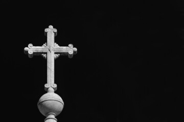 Christian religion. Holy cross at the top of monument erected in Tiber Island in Rome and erected...