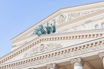 Bronze sculpture of a rider in a chariot drawn by four horses on the facade of the Bolshoi Theater in Moscow