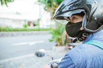 Close up of man wearing helmet on a motorcycle