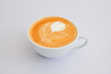 Cup hot latte with flower textured on white background.