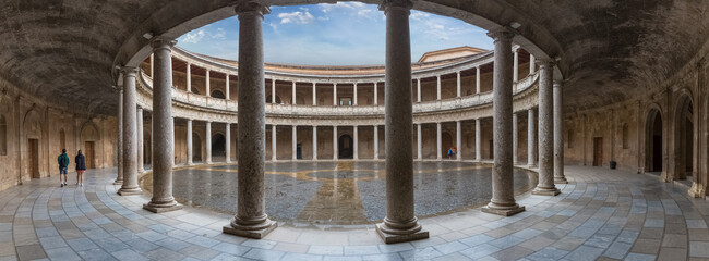Panoramic view at the interior circular Patio on Charles V Palace, Renaissance building located on...