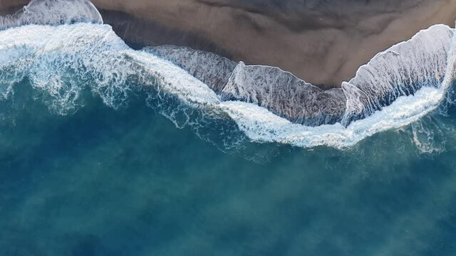 Overhead Of Windy Waves Of The Ocean At Sunrise