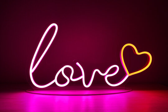 Pink and red neon heart with the inscription love. Valentine day. Neon sign. Custom neon. Home decor. Trendy style. Wedding design.
