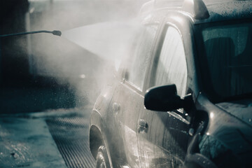 Dirty offroad car in a car wash