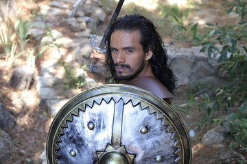 Heroic long haired warrior with sword and shield