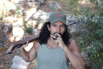 Guerrilla fighter with weapon and cigar