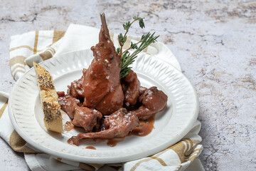 Traditional rabbit meat stew with red wine sauce