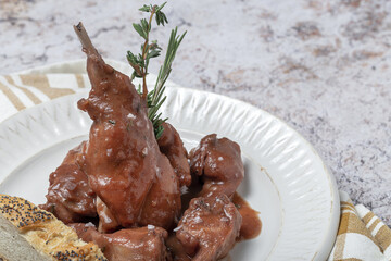 Traditional rabbit meat stew with red wine sauce