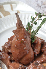 Traditional rabbit meat stew with red wine sauce
