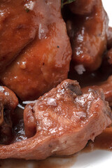 Traditional rabbit meat stew with red wine sauce