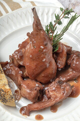 Traditional rabbit meat stew with red wine sauce