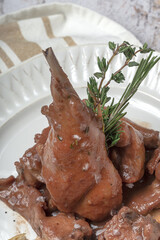 Traditional rabbit meat stew with red wine sauce