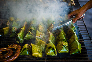 Pork buns and fish buns wrapped in banana leaves and grilled over a charcoal fire are traditional dishes of northern Thailand.