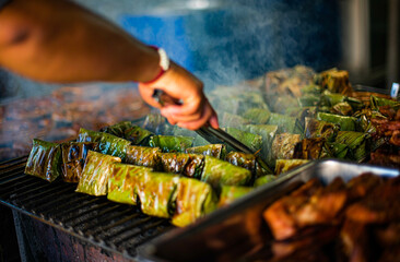 Pork buns and fish buns wrapped in banana leaves and grilled over a charcoal fire are traditional dishes of northern Thailand.