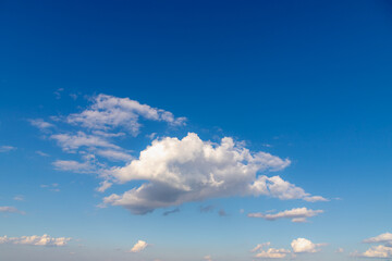 Beautiful white fluffy cloud floating in blue sky in sunny day, Cumulus are clouds which have flat...