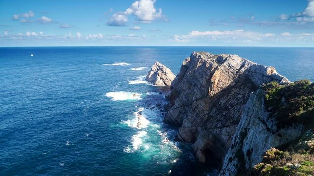 Seascape of Atlantic ocean and Asturias rocky coast at Cape Penas. Sea shore with high cliffs in north Spain.