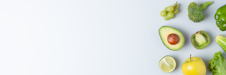 Fresh fruits and vegetables on grey background. Healthy eating concept. Flat lay, copy space.