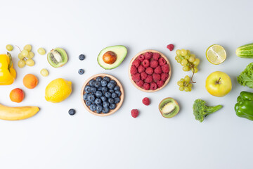 Fresh fruits and vegetables on grey background. Healthy eating concept. Flat lay, copy space.