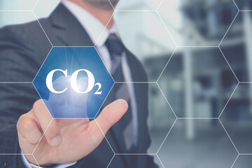 CO2二酸化炭素のボタンを押すビジネスマン Businessman touching Co2 carbon dioxide...