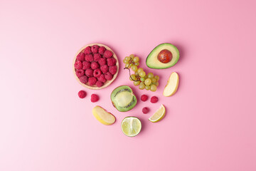 Fresh fruits and vegetables on pink background. Healthy eating concept. Flat lay, copy space.