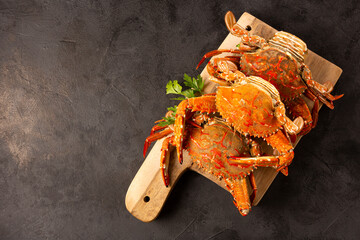 Dish of cooked crabs on the table.