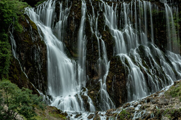 Fototapeta na wymiar Beautiful cascade of waterfalls. Aladagla National Park. Kapuzbashi waterfalls. Turkey