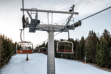 Ski resort image with empty chair lift. Ski-lift