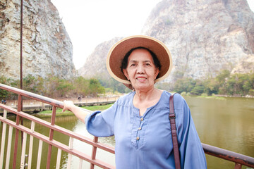 Asian elderly woman nature travel She is happy in retirement. Travel concept, retirement living, health care