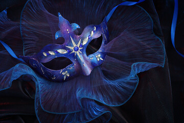 Fototapeta Photo of elegant and delicate Venetian mask over blue dark background obraz