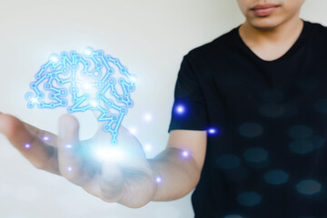 man holding abstract wireframe of brain structure, creative and innovation idea